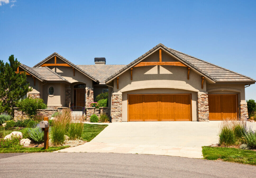 Typical suburban Denver home with a lush front lawn and spacious driveway.